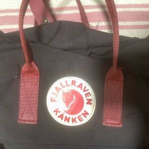 black and rust fjall raven kanken backpack
